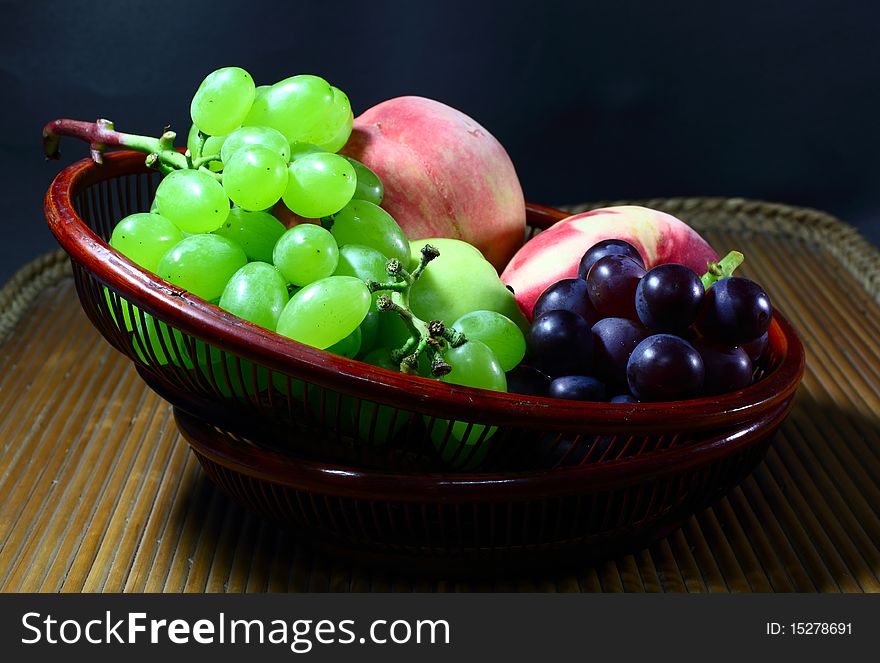 Group of different fruits in  in the technology bamboo tray.