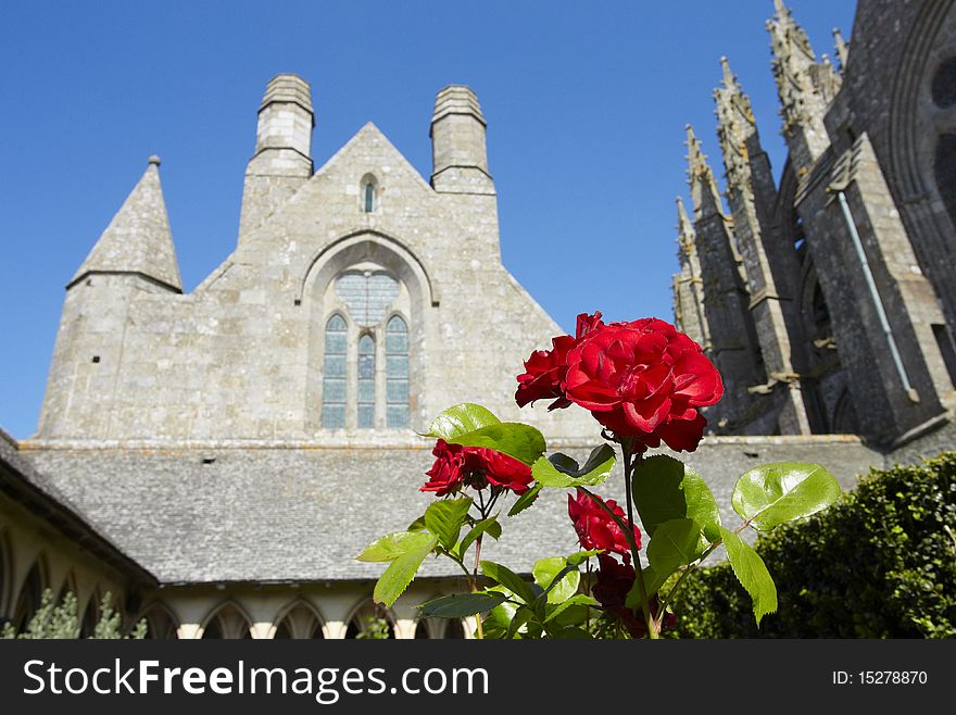 Isolated red rose against monastery background. Isolated red rose against monastery background
