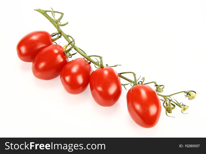 Bunch of tomatoes on white background