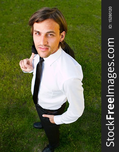 Young businessman in garden