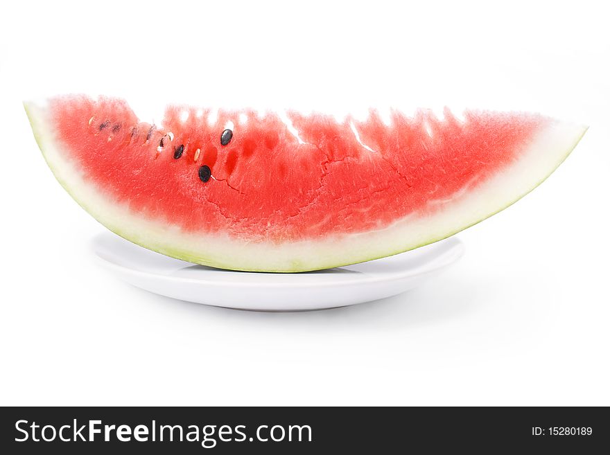 Slice of watermelon in plate close up isolated over white bacground. Slice of watermelon in plate close up isolated over white bacground