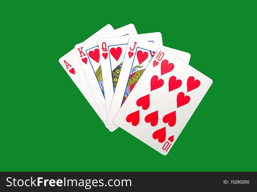 Playing cards isolated against green background