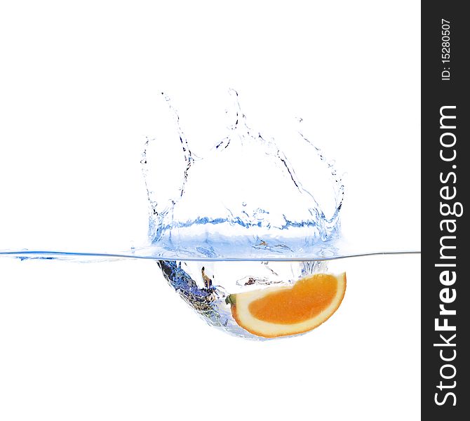 Orange slice in water on white background