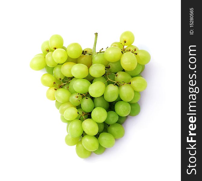 Green grapes against white background.