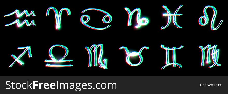 Signs of the zodiac on a black background. Freezelight. photography style