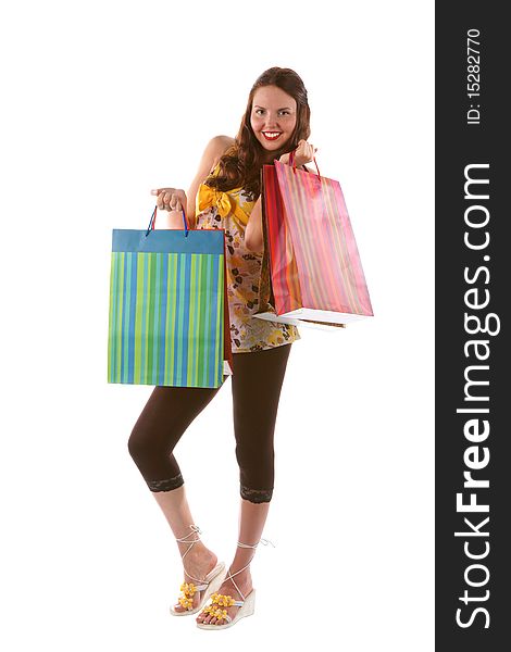 Pretty shopping girl with bags (isolated)