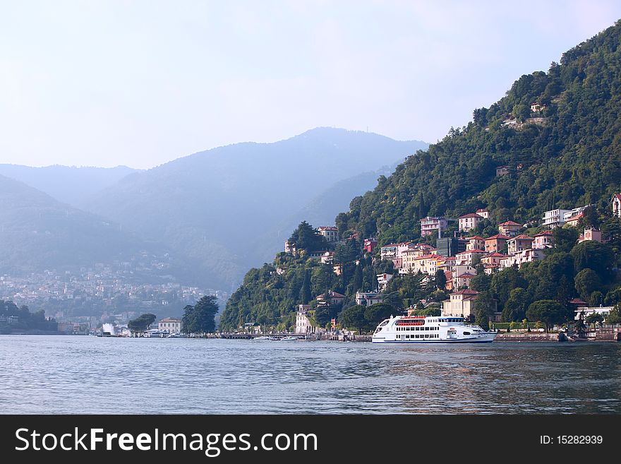 Residential buildings adorn the hillside around Lake Como in Italy.