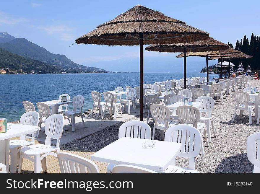 A Cafe by the side of Lake Garda near SalÃ², comune in the province of Brescia, in Lombardy, Italy. A Cafe by the side of Lake Garda near SalÃ², comune in the province of Brescia, in Lombardy, Italy.