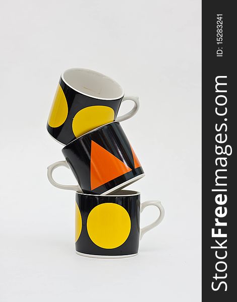 Coffee cups tower on white background