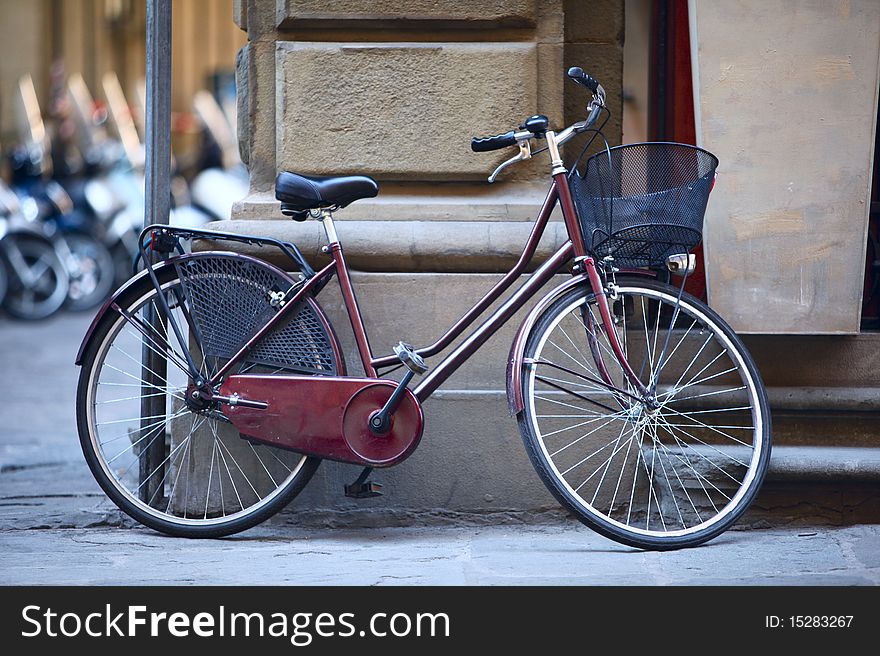 A bicycle parked outside a building in Florence, Italy. Bicycles are common sight in Italian cities and widely used by commuters as a common mode of transport. A bicycle parked outside a building in Florence, Italy. Bicycles are common sight in Italian cities and widely used by commuters as a common mode of transport.