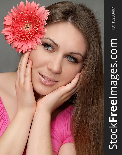 Portrait of young woman with flower. Portrait of young woman with flower