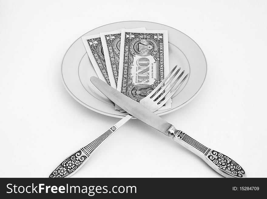 Dinner service with dollar denominations on plate. B&W. Dinner service with dollar denominations on plate. B&W