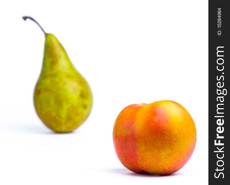 Horizontal image of isolated green pear and peach. Horizontal image of isolated green pear and peach