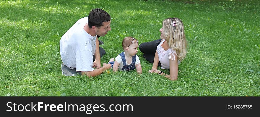 Young family have a rest in park