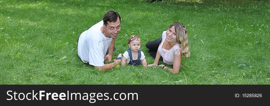 Young family lay in park