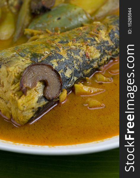 Fish curry on banana leaf background. Fish curry on banana leaf background