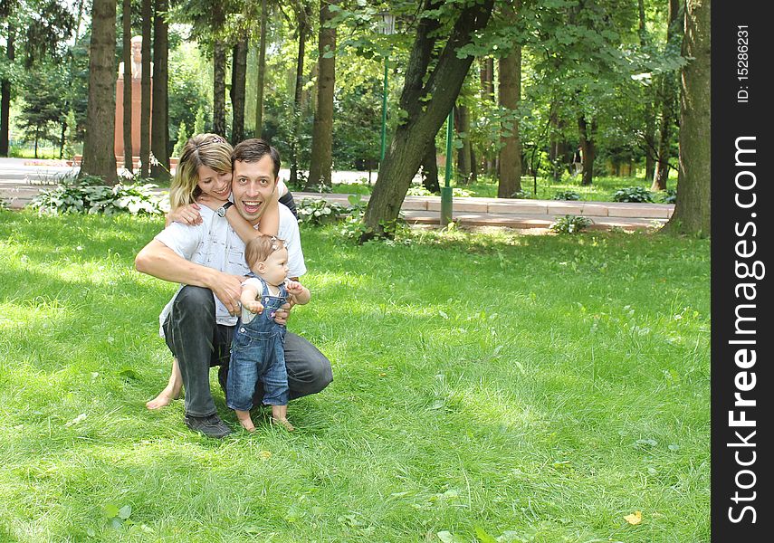 Young family have a rest in park