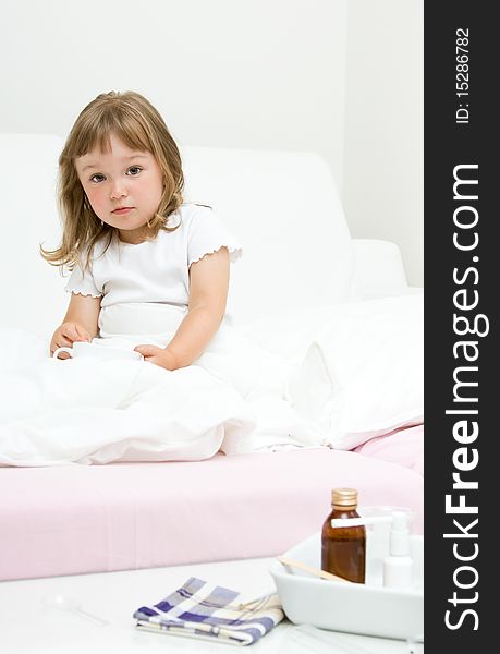 Sick little girl  on bed