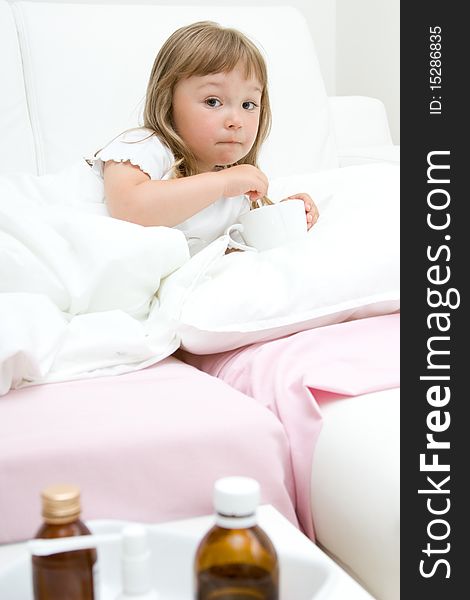 Sick little girl  on bed