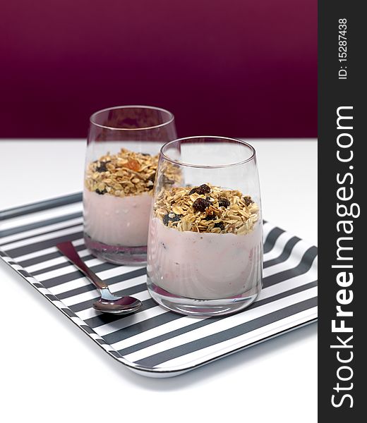 Strawberry yogurt with muesli in a glass. Strawberry yogurt with muesli in a glass