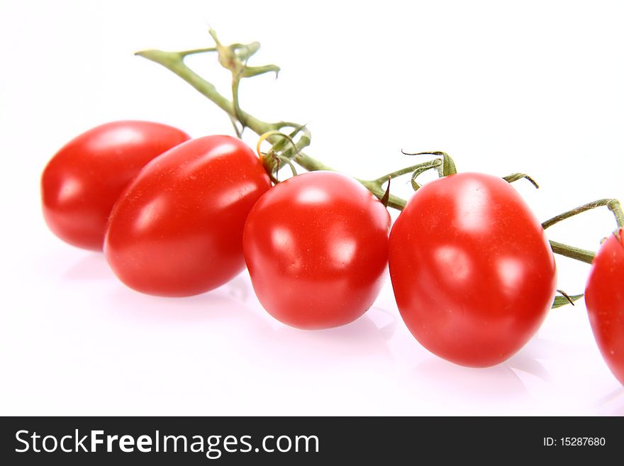 Bunch of tomatoes on white background