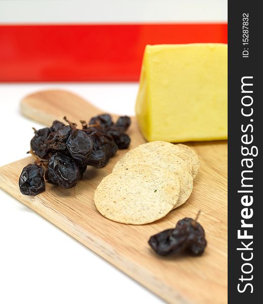 A selection of cheeses on a cutting board. A selection of cheeses on a cutting board