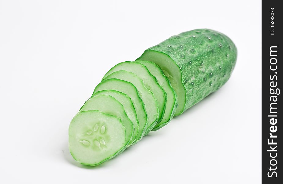 Chopped cucumber on a white background