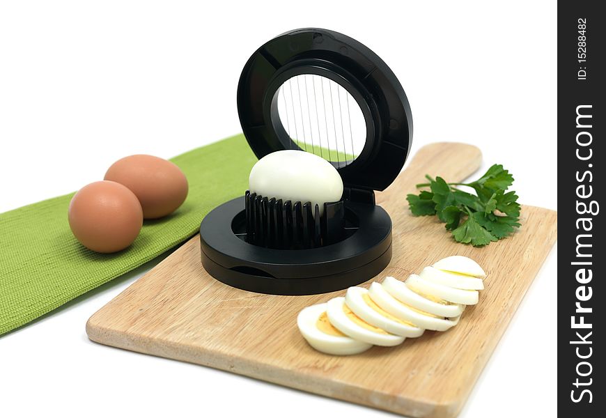 An egg slicer isolated against a white background