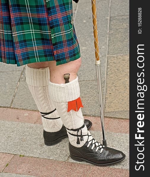 An image of a Scottish Pipe Major's kilt, socks, shoes, dirk and staff. An image of a Scottish Pipe Major's kilt, socks, shoes, dirk and staff.