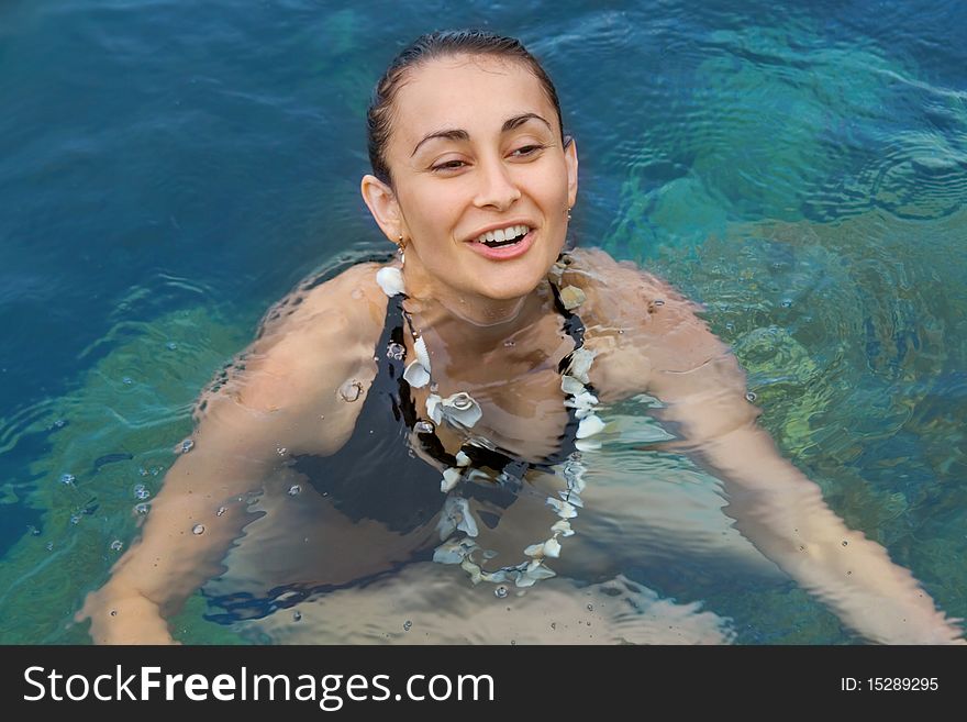 Young girl bathing in the sea