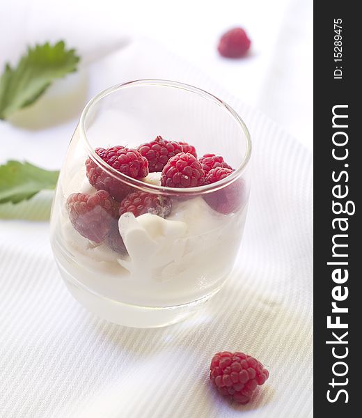 Ice cream with fresh raspberries in glass. Ice cream with fresh raspberries in glass