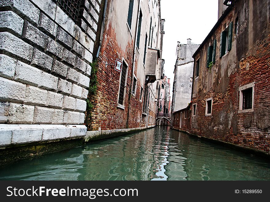 Photographed walking through a Venice canal