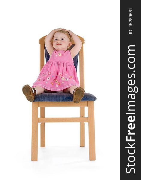 Merry child sit on chair on white background.