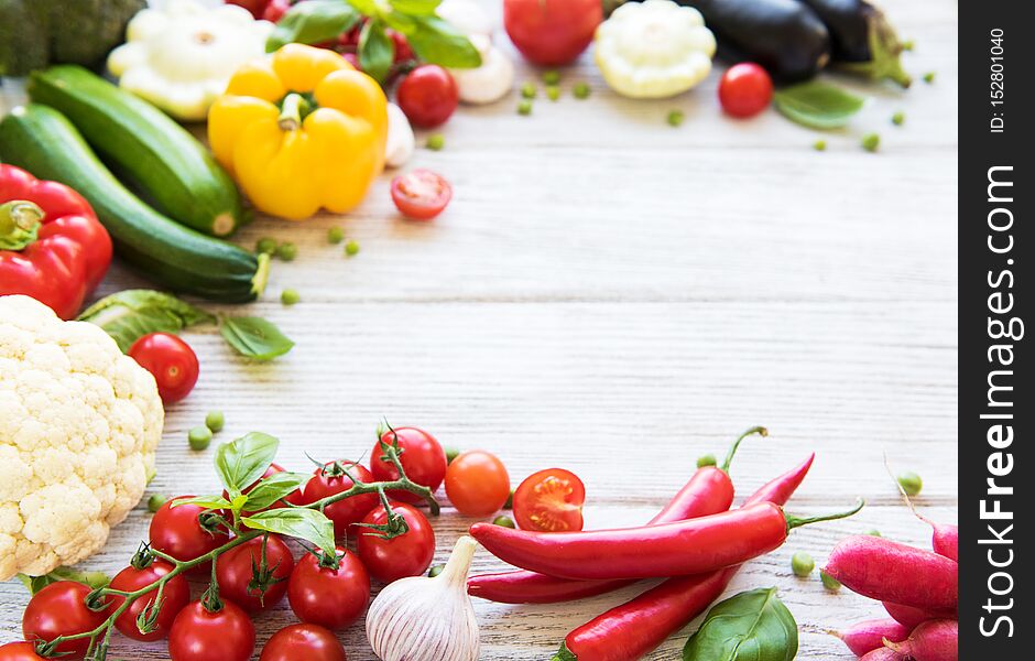 Different raw vegetables on a old wooden table