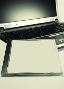 Cd Case On Laptop Stock Photos Cd Case On Laptop Stock Photos