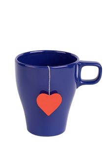 Tea Bag With Red Heart-shaped Label In Blue Cup Royalty Free Stock Image Tea Bag With Red Heart-shaped Label In Blue Cup Royalty Free Stock Image