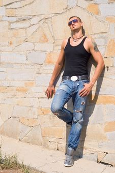 Young Man In Street Wear Is Looking At The Sun Royalty Free Stock Images