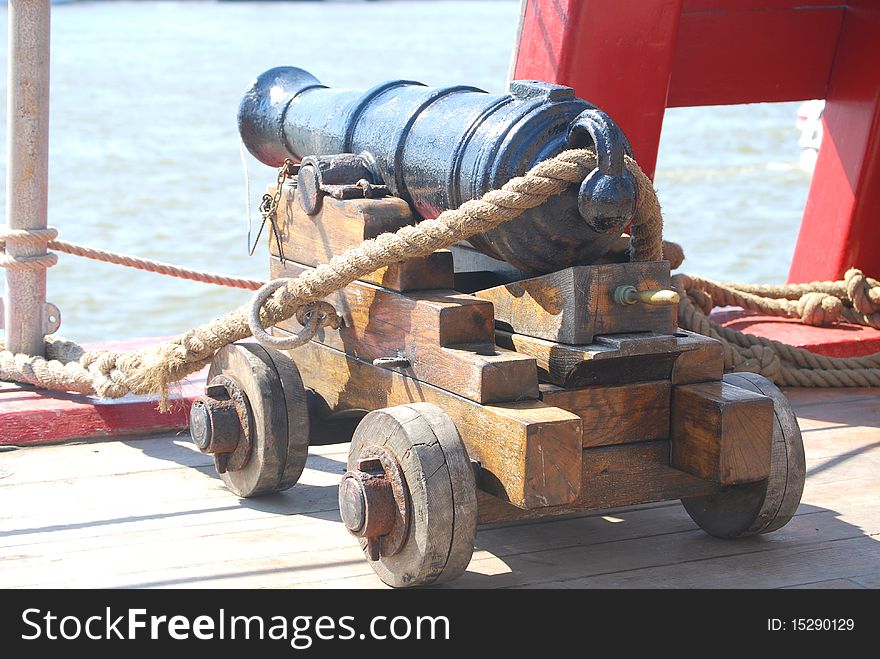 A six pound cannon on the deck of a British Man of War antique warship. A six pound cannon on the deck of a British Man of War antique warship.
