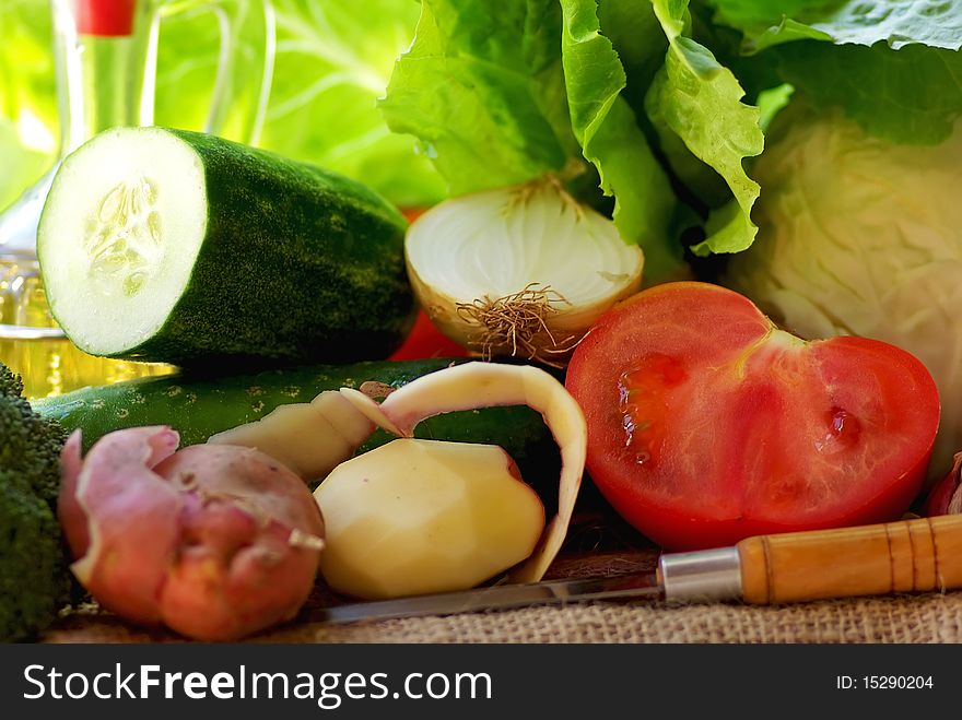 Bottles of Oil vinegar and vegetables.