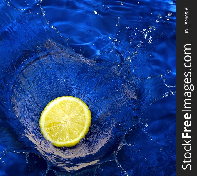 Lemon Splashing Blue Water