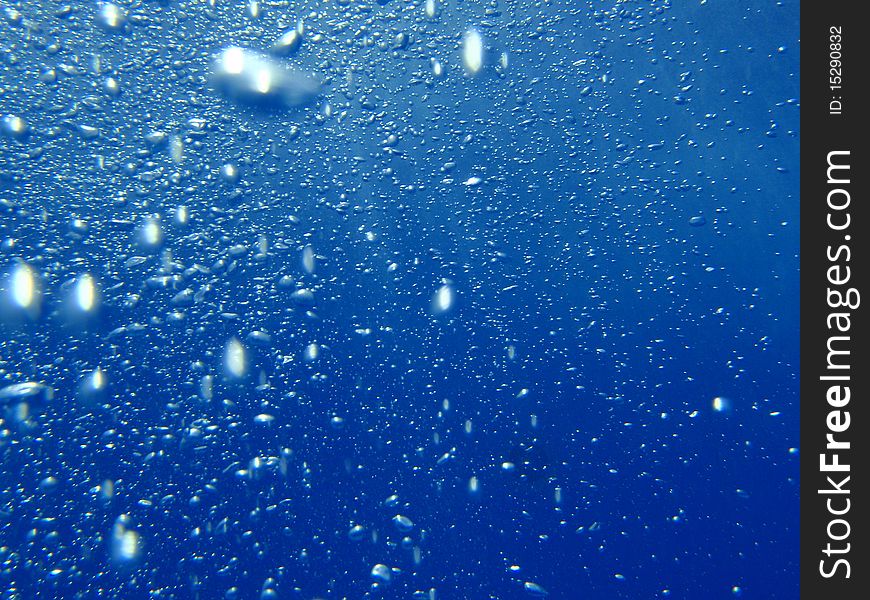 Blue underwater background with water air bubbles