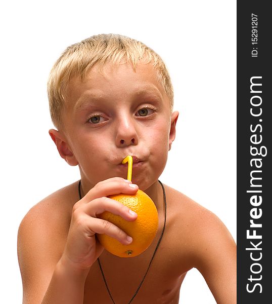 The boy drank the juice from an orange through a straw is isolated on a white background. The boy drank the juice from an orange through a straw is isolated on a white background.