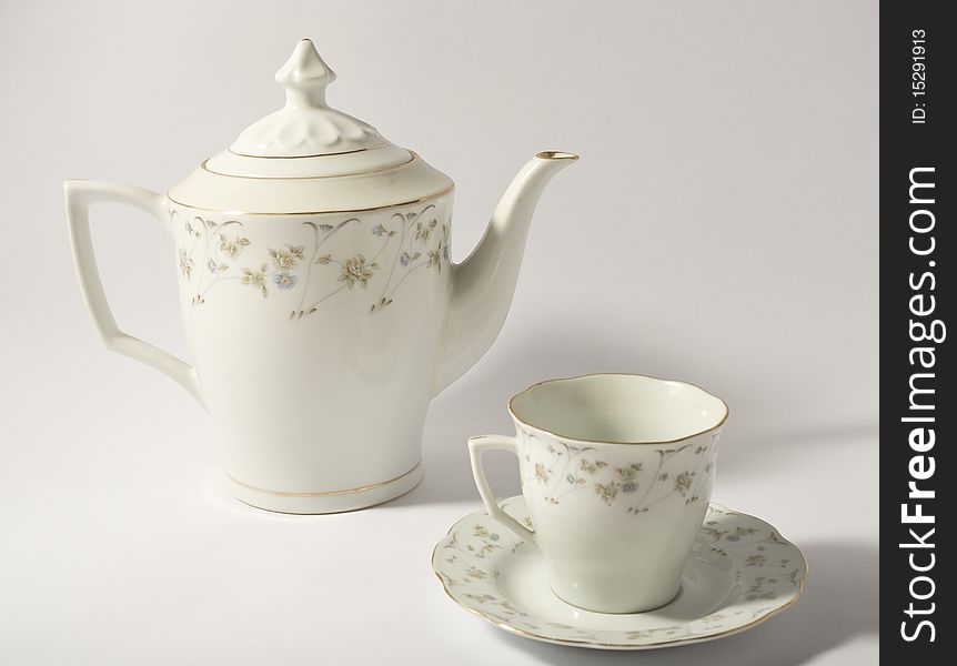 Ceramic teapot and a tea cup. Ceramic teapot and a tea cup.