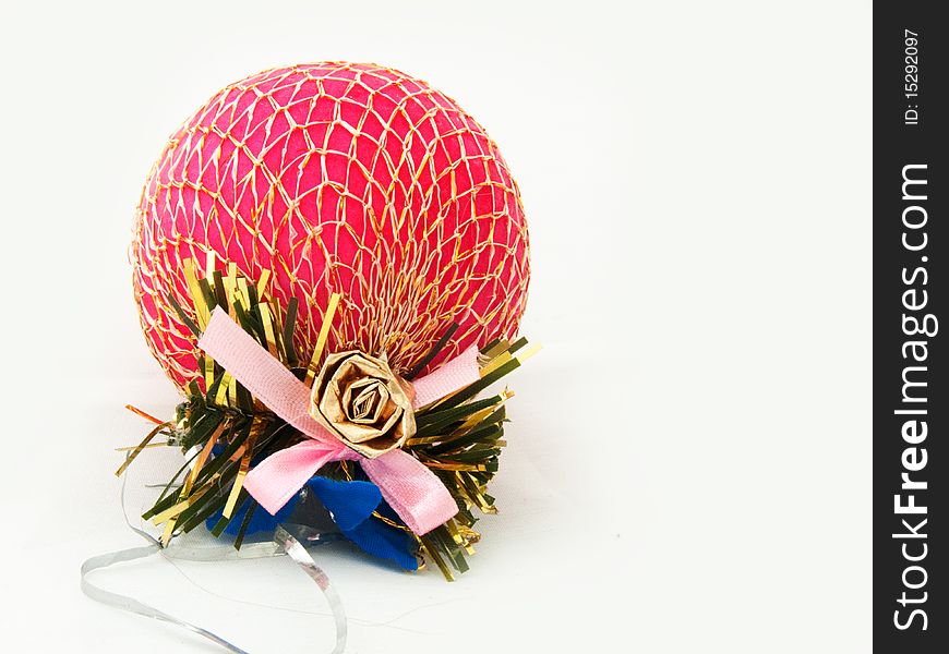 Single red Christmas ornament with pink ribbon