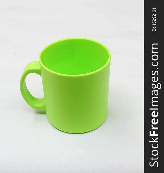 Green cup, isolated in the white background