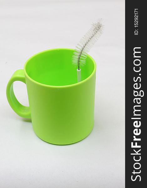 Cup and brush, isolated in the white background