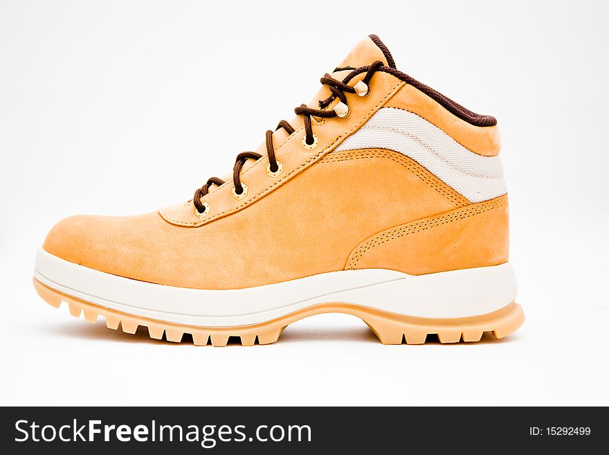 Peach-yellow hiking boot isolated over white background