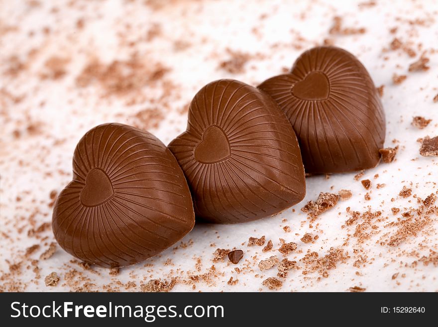 Three Chocolate Hearts On White Background