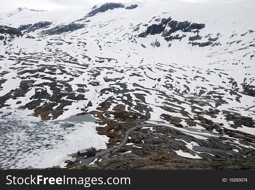 Raod with hairpins in icy mountains above Geiranger i. Raod with hairpins in icy mountains above Geiranger i