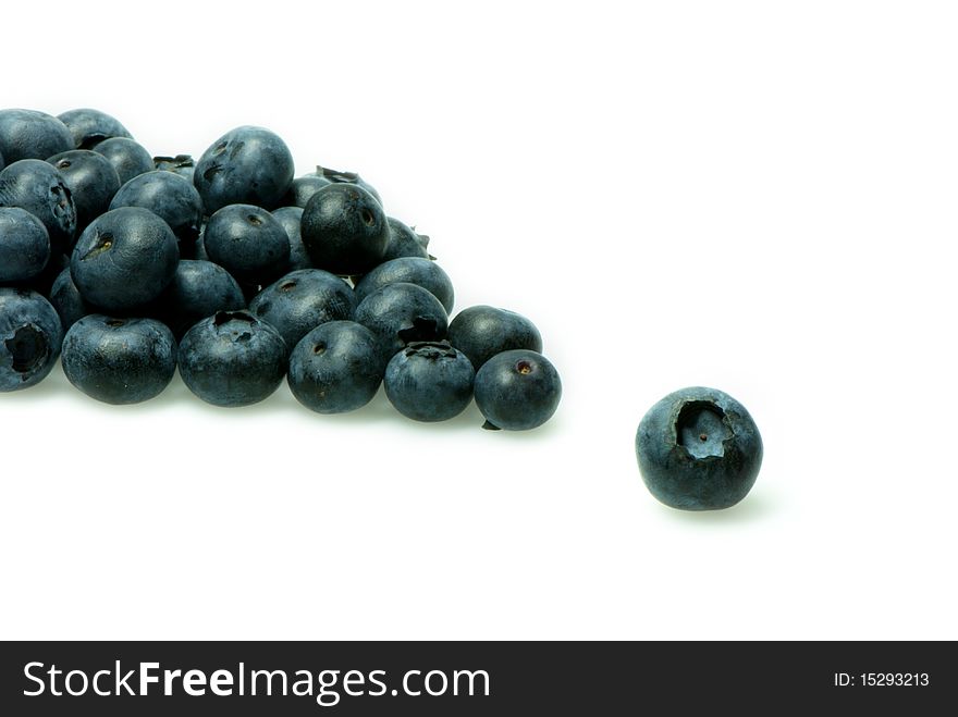 Arrangement of fresh blueberries with a single one standing out